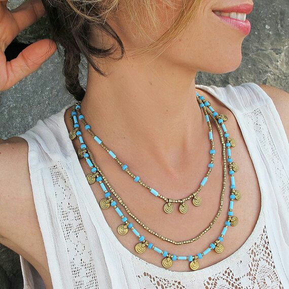 Delicate layered necklaces with boho-inspired pendants