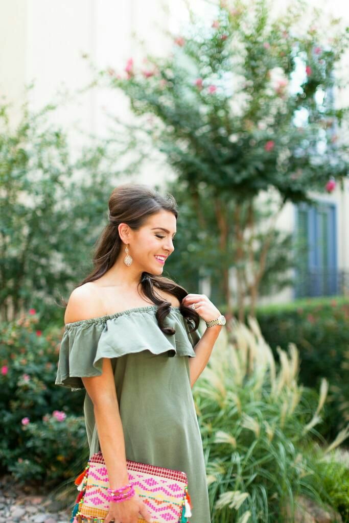 Drop earrings, off shoulder dress, clutch bag