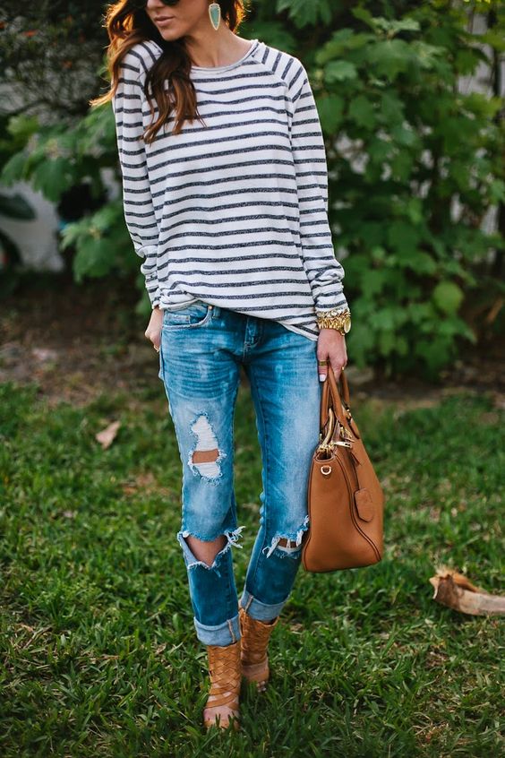 Long earrings, Striped shirt, ripped jeans