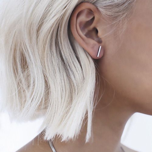 Blonde hair with minimalist-inspired studs