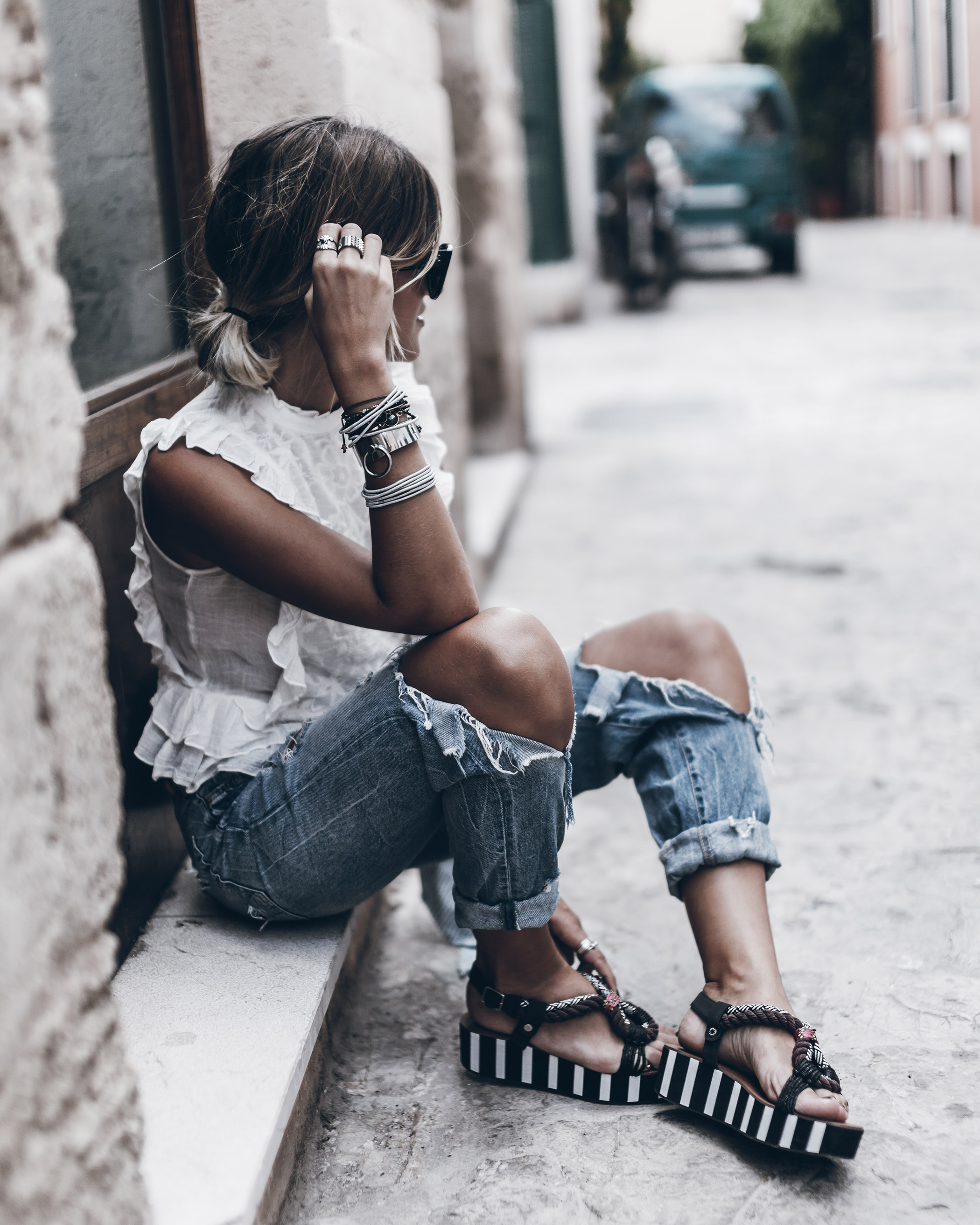 Ripped jeans and stacked bangles are a great combination