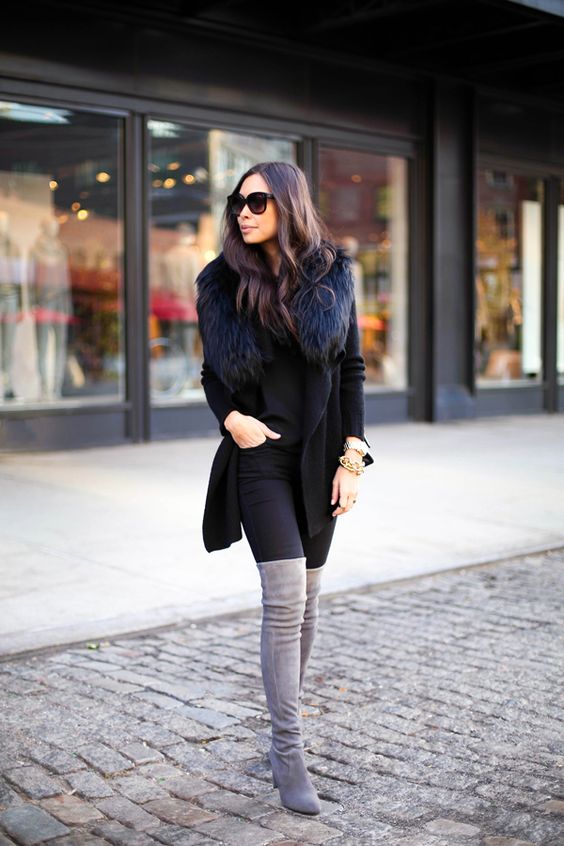 Chunky bracelets with black blazer and grey boots