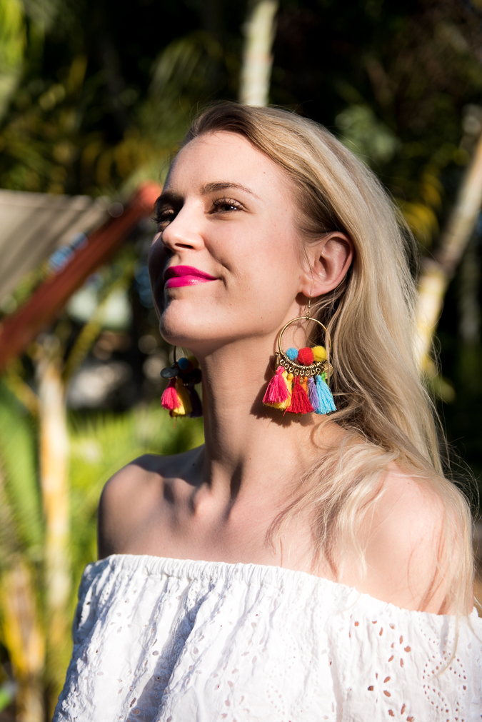 Exotic tassel earrings, off shoulder white top